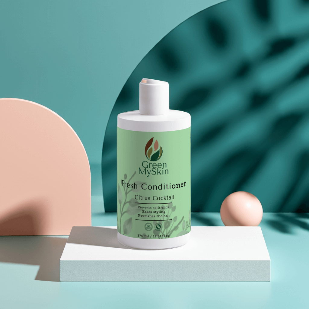 Citrus Cocktail Fresh-Conditioner bottle amidst green leaves, designed for split end prevention and hair nourishment.