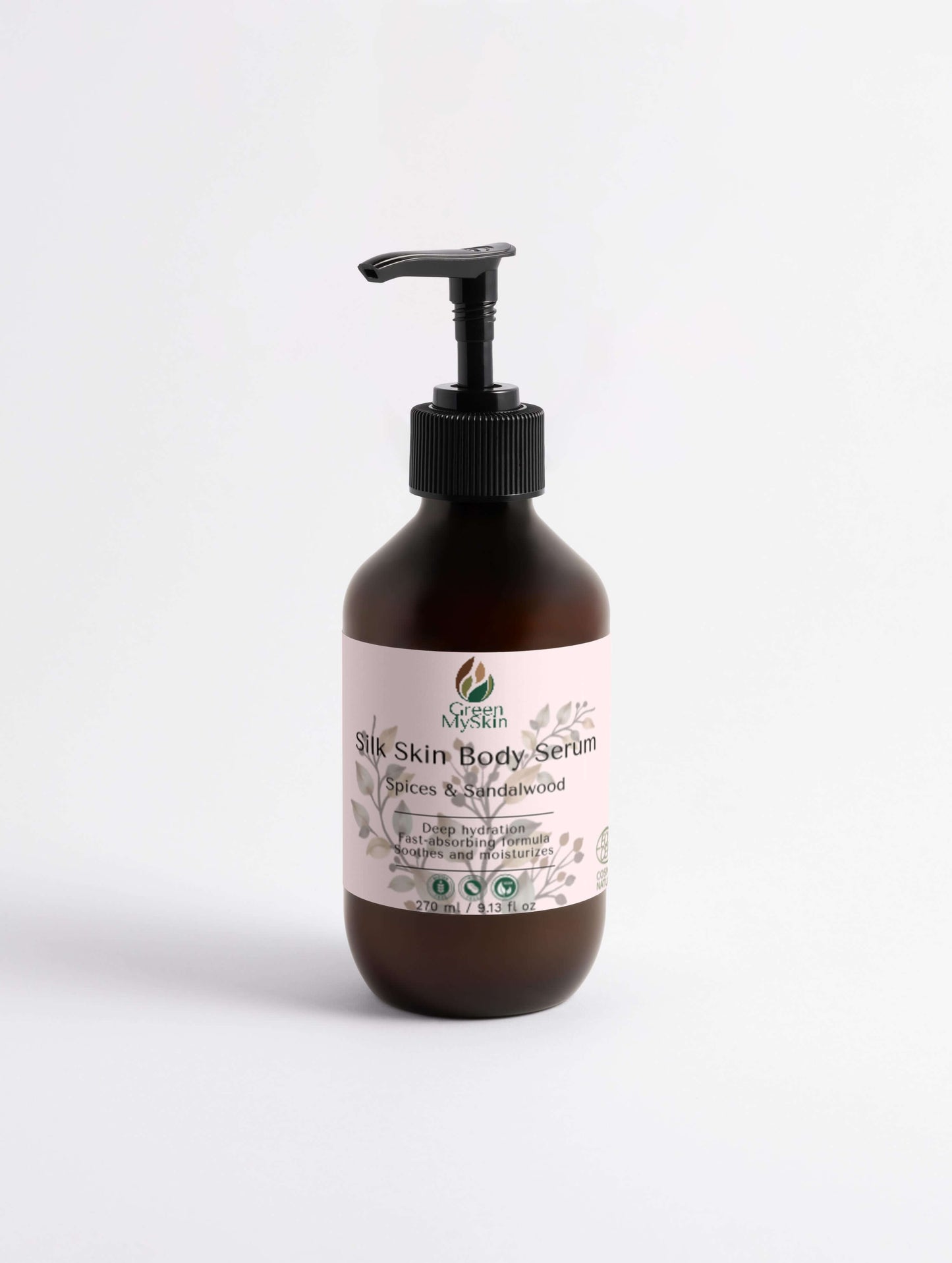 Silk Skin Body Serum with Spices and Sandalwood in a brown pump bottle for deep hydration and nourishment.