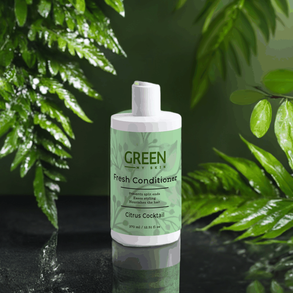 Citrus Cocktail Fresh-Conditioner bottle amidst green leaves, designed for split end prevention and hair nourishment.