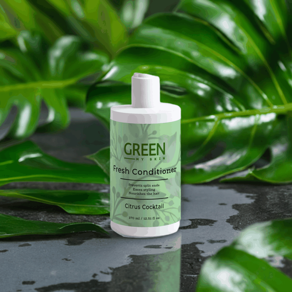 Citrus Cocktail Fresh-Conditioner bottle amidst lush greenery, ideal for preventing split ends and nourishing hair.