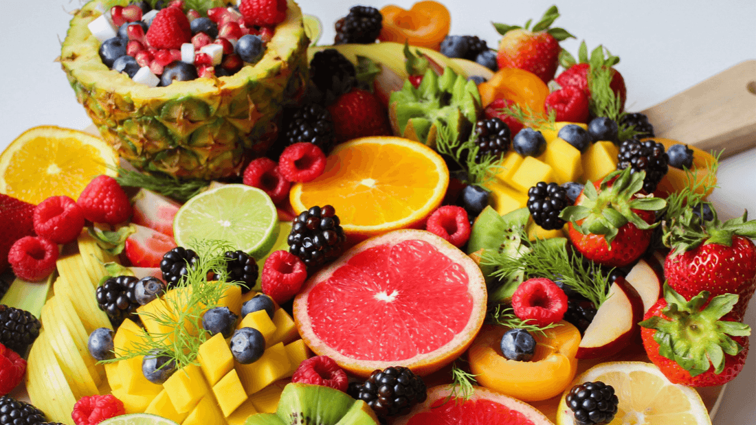 A vibrant assortment of fruits showcasing antioxidants for skin protection in a colorful arrangement.