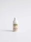 Acne Spot Care Serum bottle with pump dispenser on white background.