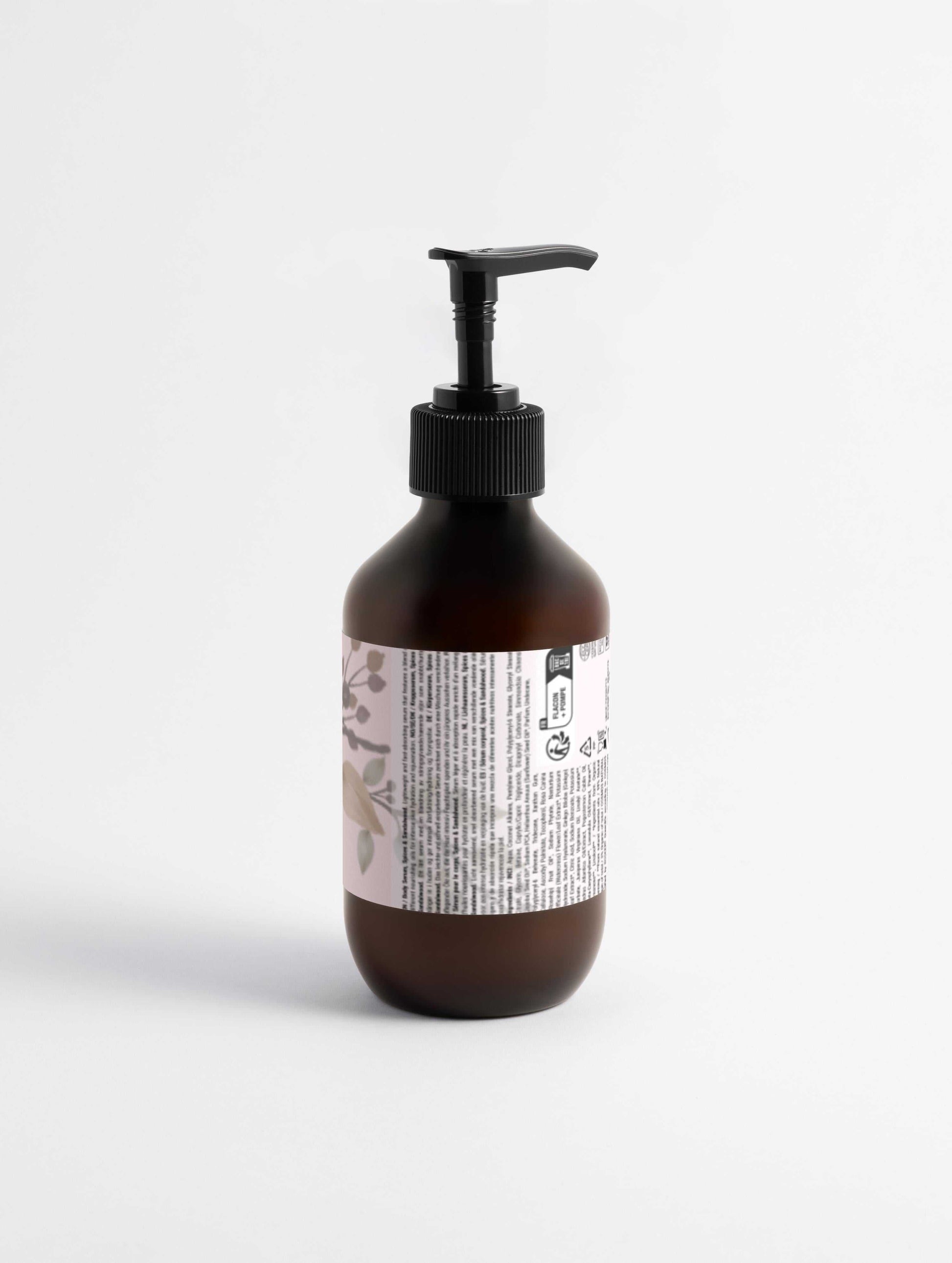 silk-skin-body-serum in amber bottle with pump, enriched with nourishing oils for deep hydration and skin protection.