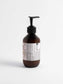 silk-skin-body-serum in amber bottle with pump, enriched with nourishing oils for deep hydration and skin protection.