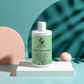 Citrus Cocktail Fresh-Conditioner bottle amidst green leaves, designed for split end prevention and hair nourishment.