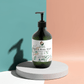 Ginger & Smoky Cardamom Hand-Body Wash, hydrating and vegan, in green pump bottle.