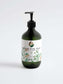 Hydrating hand and body wash with patchouli and amber vanilla scent in a pump bottle.