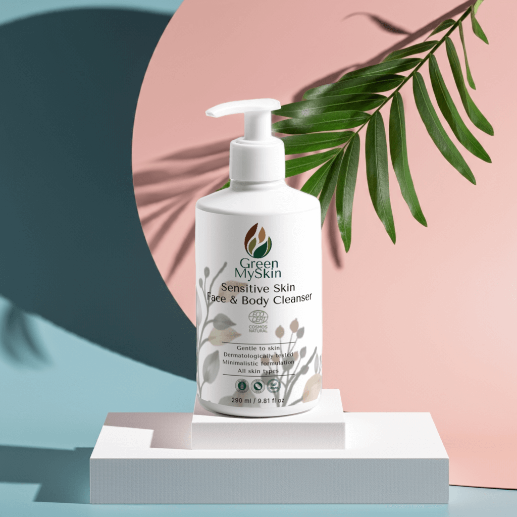 White bottle of Green MySkin Sensitive Skin Face & Body Cleanser standing in a white stand on a pastel colours background 