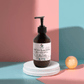 Silk Skin Body Serum with Spices & Sandalwood in amber bottle on display, promoting deep hydration and nourishment.
