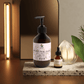 silk-skin-body-serum bottle with pump, offering deep hydration and woody amber & leather scent