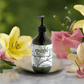 Hydrating hand-body wash with patchouli, amber vanilla scent in a botanical background.