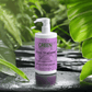Gloss-shampoo with Smoky Green Vetiver, 400ml bottle on leafy background, for shiny, smooth, fragranced hair.