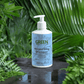 Gentle Moisturising Shampoo bottle surrounded by lush green leaves, promoting daily hair care.