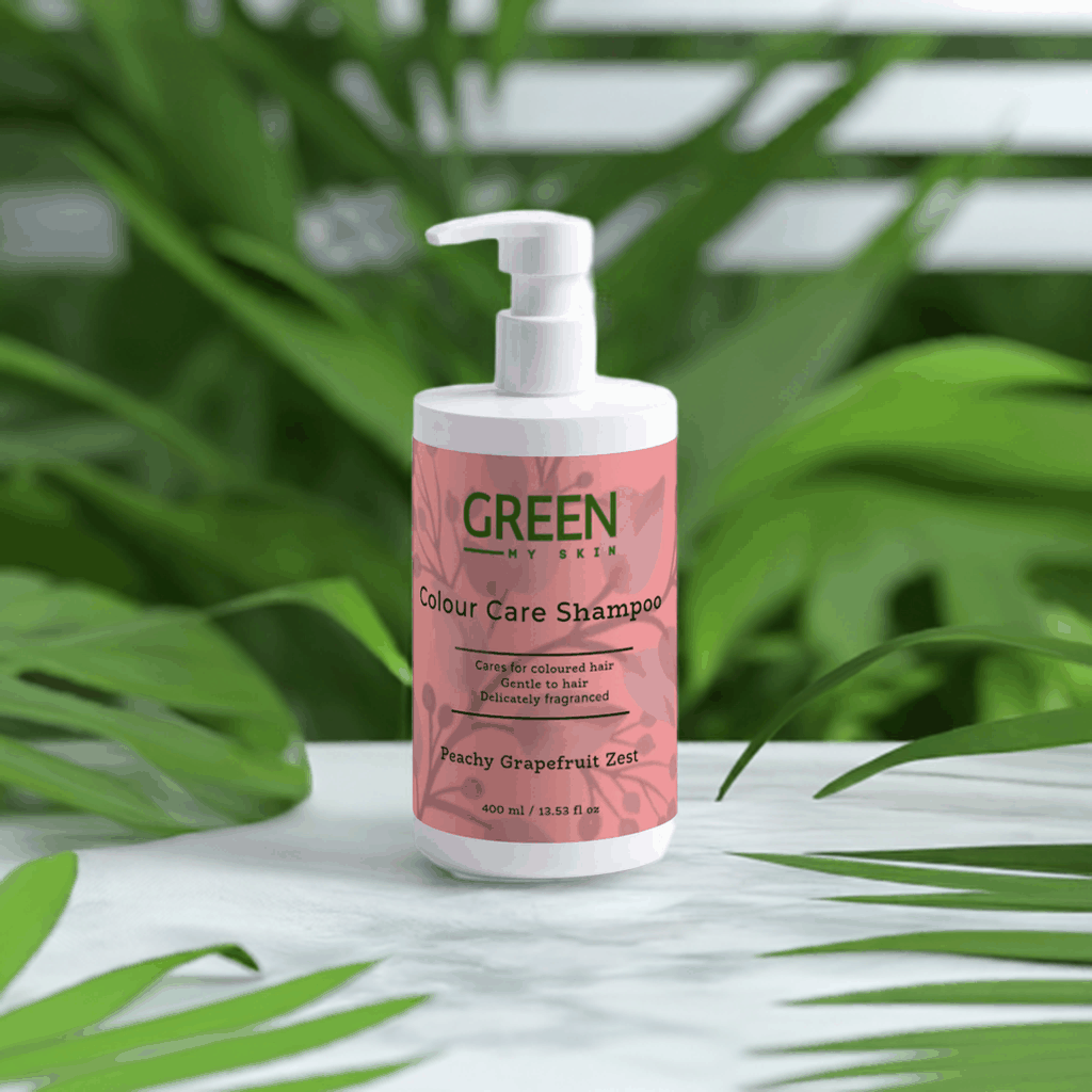 Colour-care shampoo for coloured hair with peachy grapefruit zest, gentle and delicately fragranced bottle on leafy background.