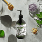 Ginger & Smoky Cardamom Hand-Body Wash bottle for hydrating skincare, vegan formula.