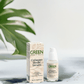 Collagen Boost Serum bottle and packaging with plant in the background.