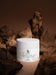 Green My Skin White jar of Icelandic Volcano Face & Body Scrub on a brown background with natural elements.